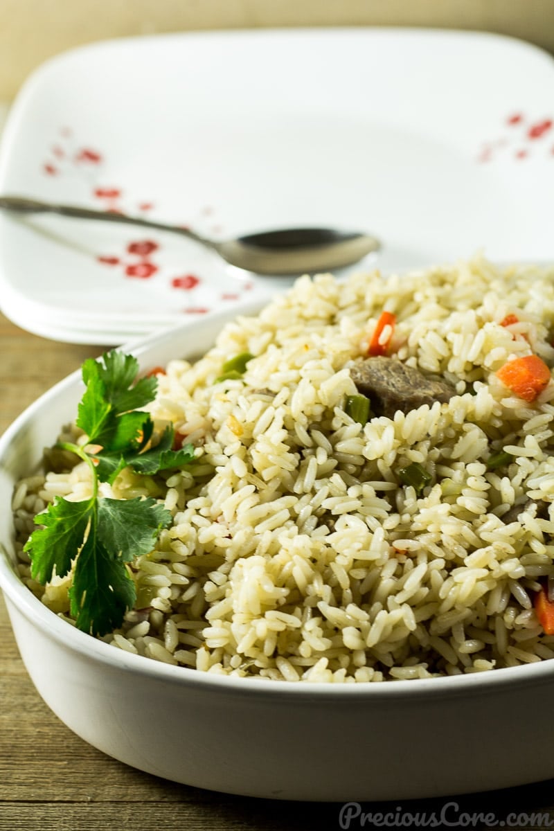 Cameroonian Coconut Rice - African coconut rice recipe. All you need is 10 ingredients and one-pot to make this coconut rice dinner. So good! Get the recipe on Precious Core. #onepot #dinner #easymeals #africanfood #preciouscore