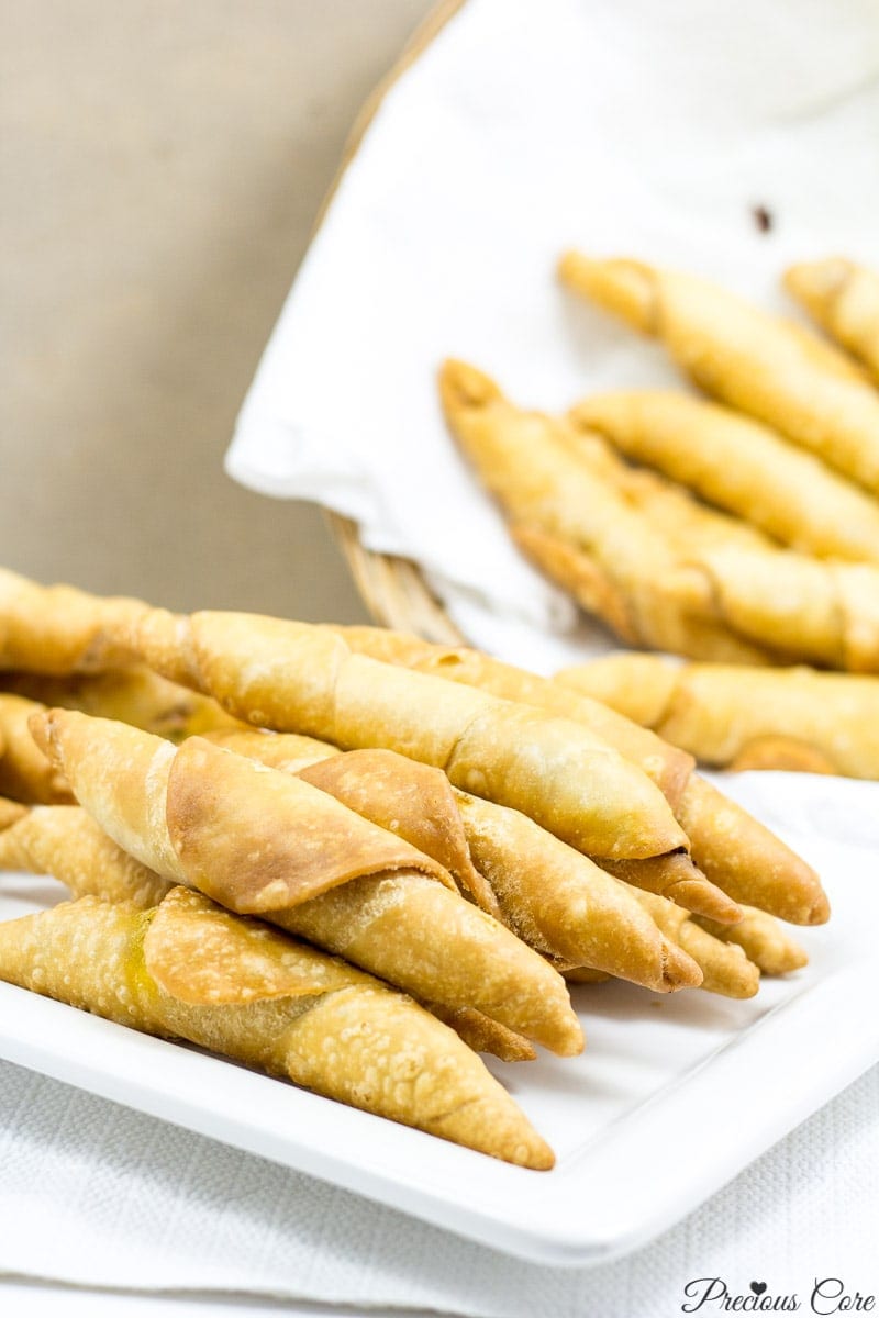 Plate and basket of Cameroonian fish rolls.