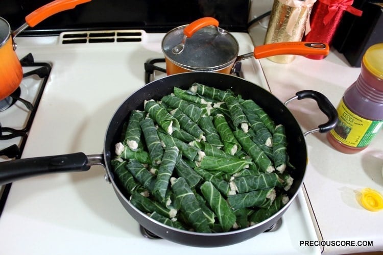 Cocoyam paste wrapped in leaves and in a skillet.