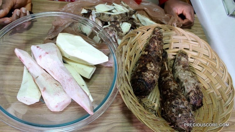 Bowls of peeled and unpeeled cocoyams.