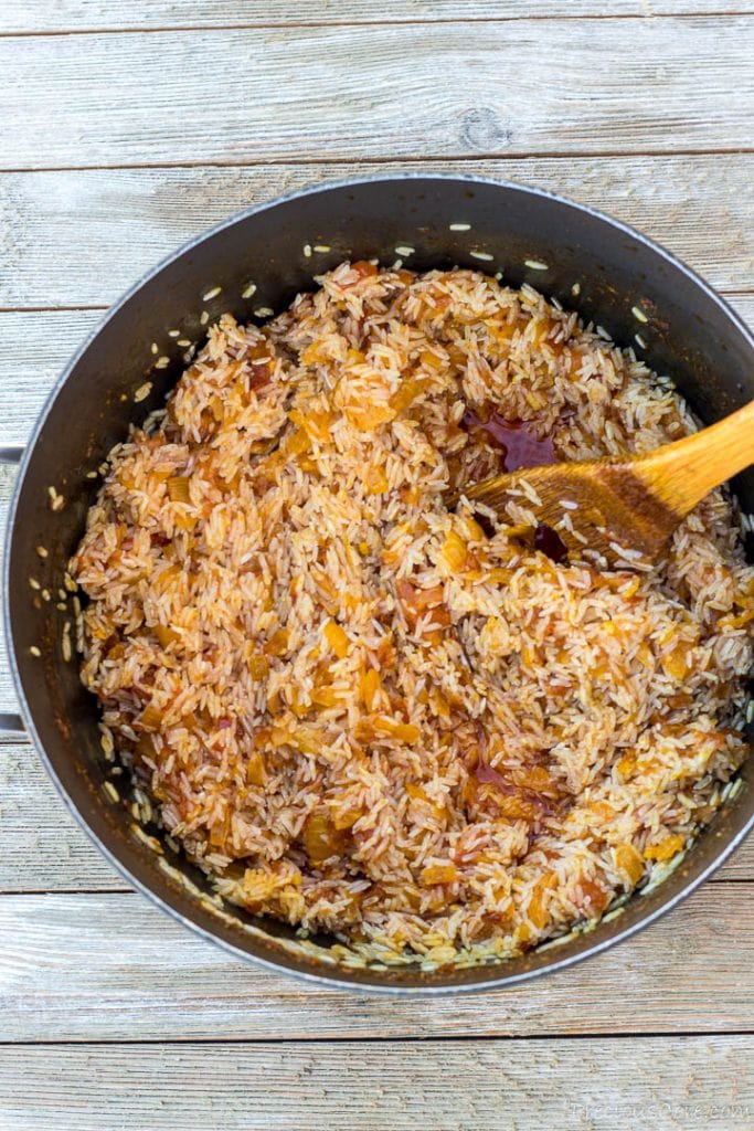 washed rice in pot for palm oil jollof rice