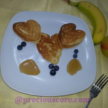 Heart shaped pancakes on a plate.