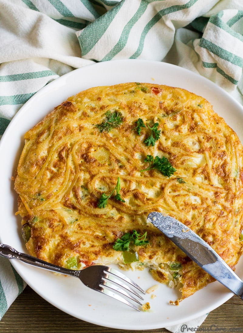 Spaghetti Omelette or Spaghetti Frittata on a white plate.