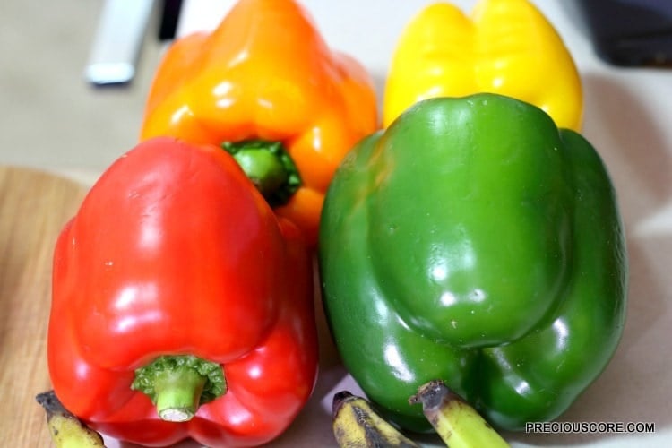 Red, green, orange, and yellow bell pepper.