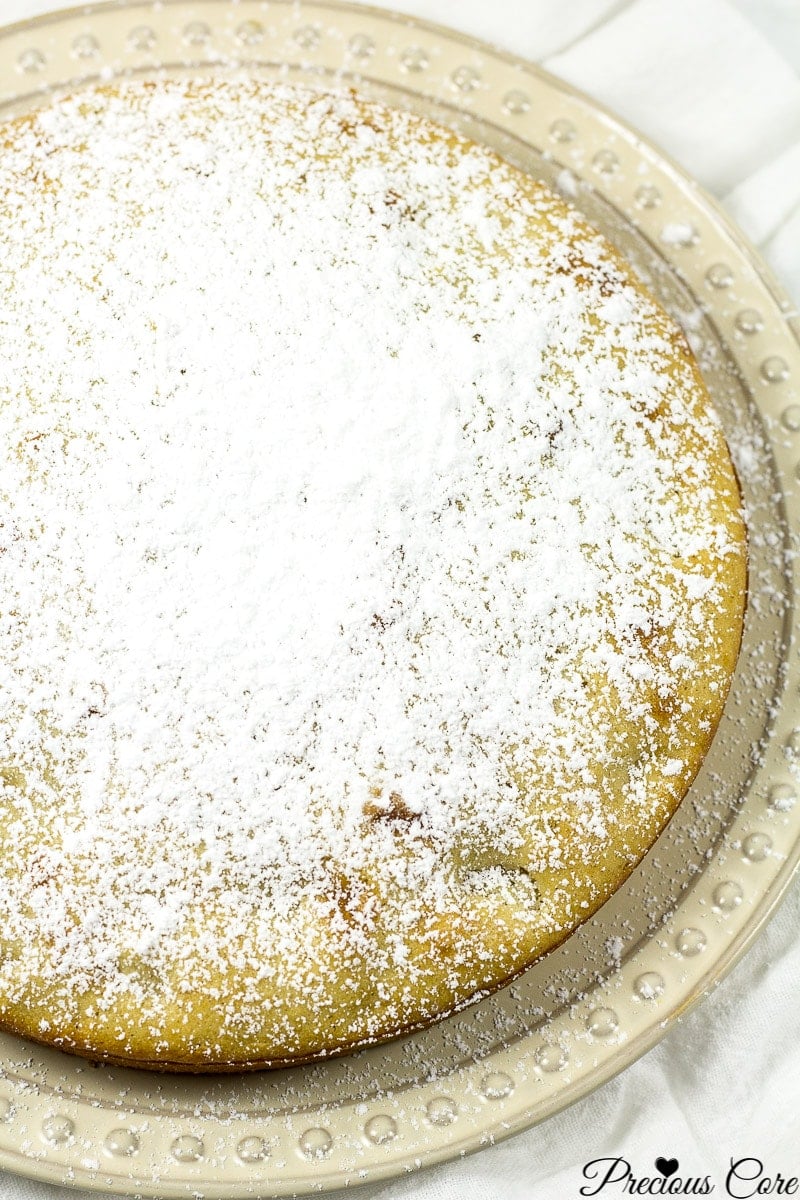 Old fashioned fresh apple cake dusted with powdered sugar.