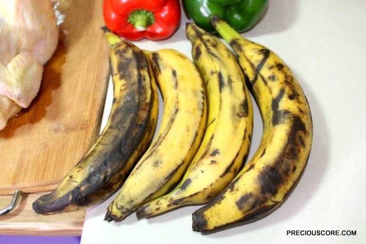 Brown plantains with peppers on a counter.