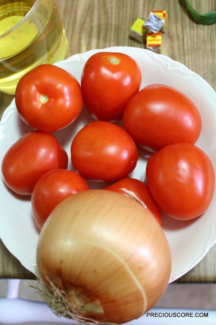 Tomatoes and onion in a bowl.