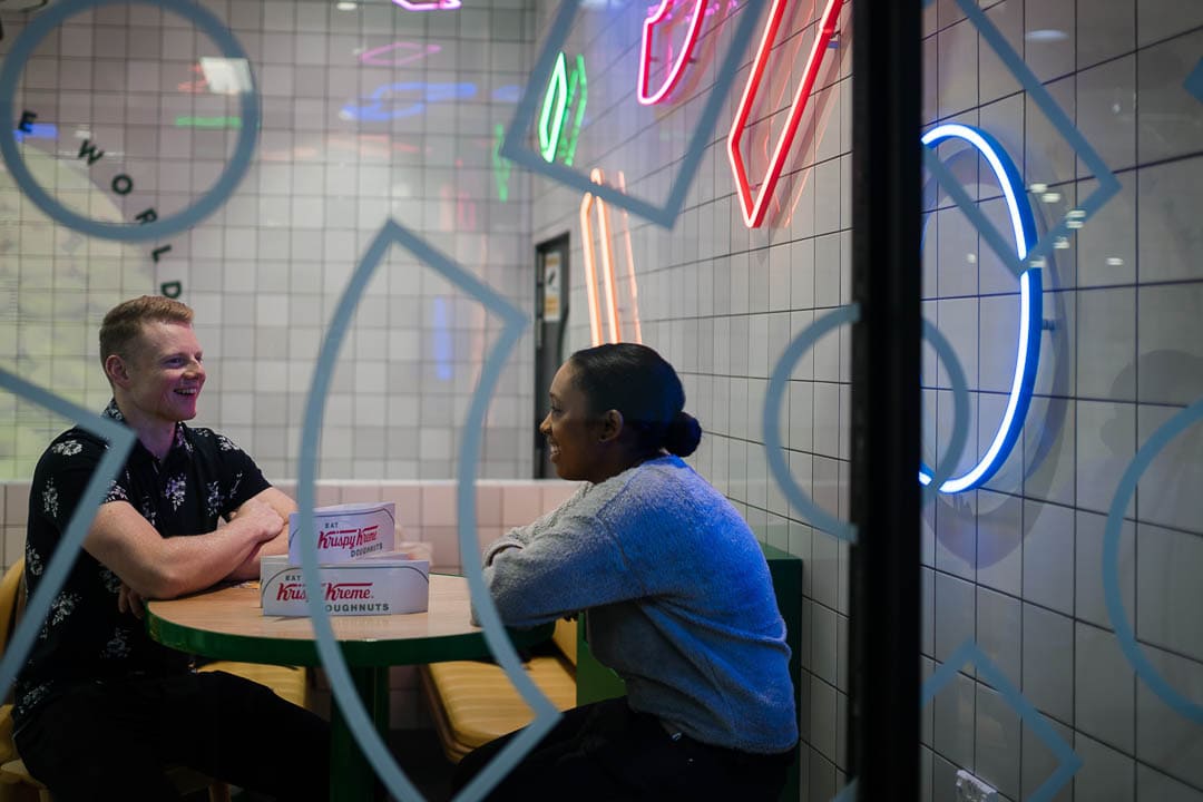 Man and woman sitting in store