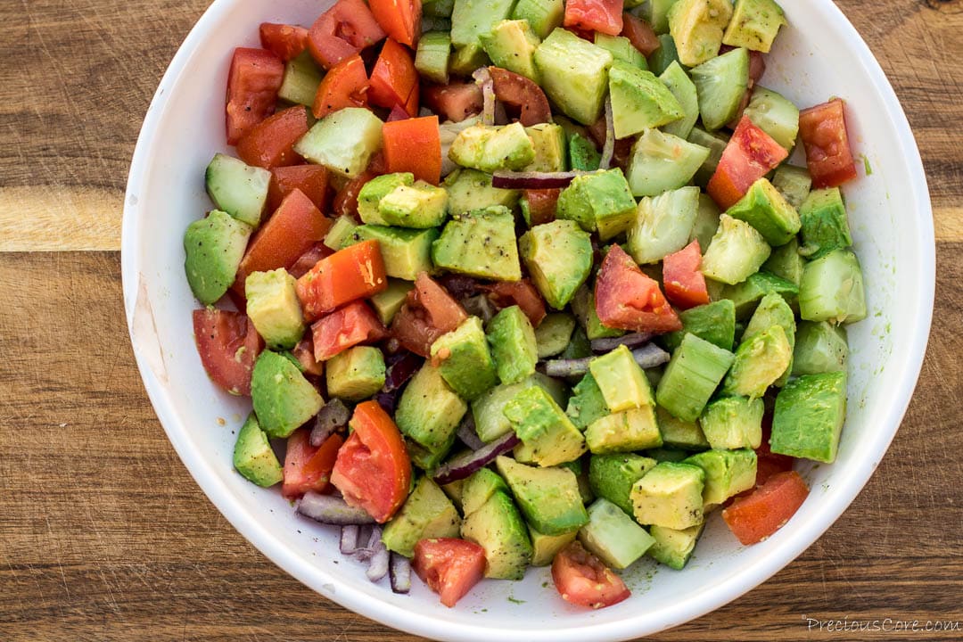 Avocado tomato cucumber salad in a bowl