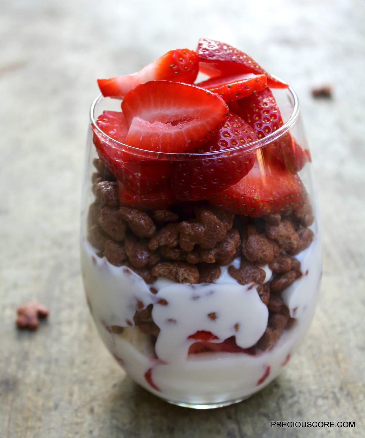 Yogurt parfait in a small glass.