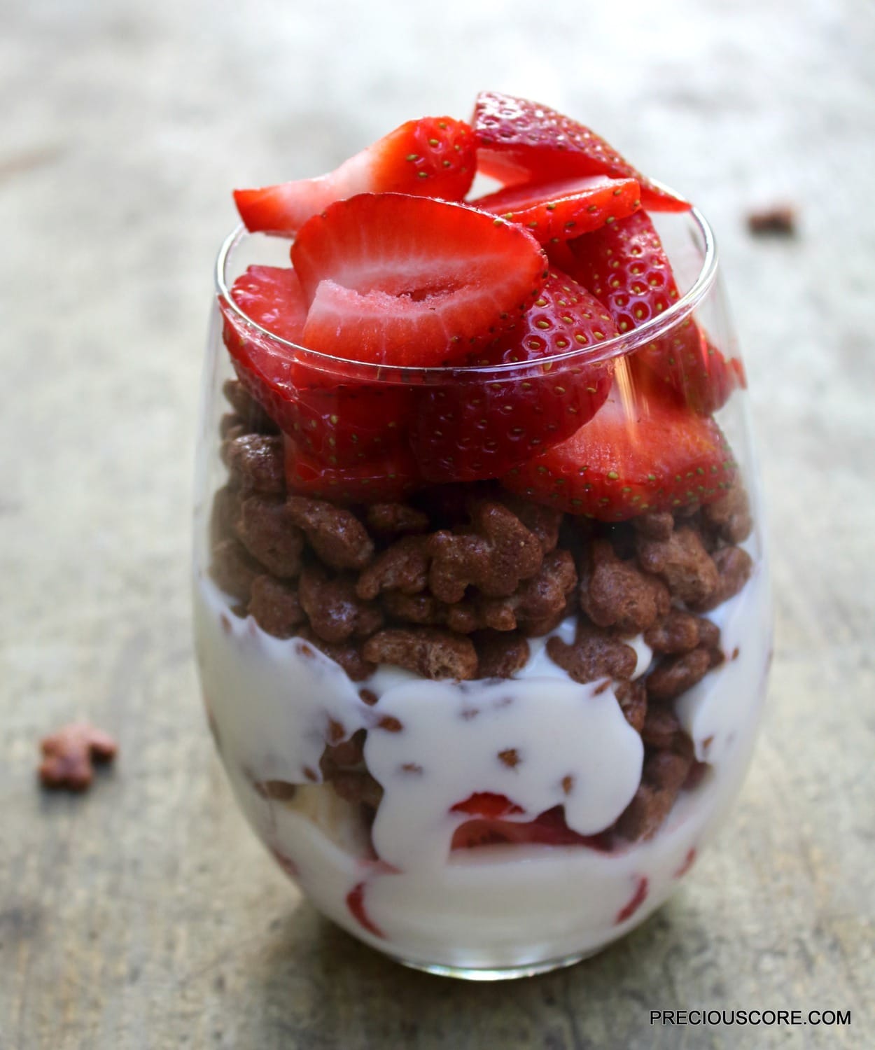 Yogurt parfait in a small glass.