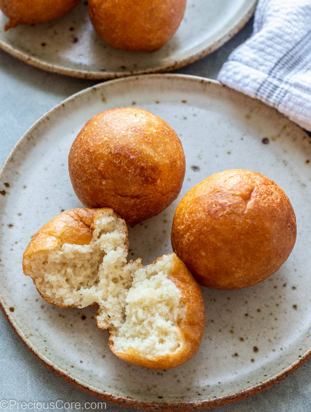 3 balls on a plate with one opened to show texture.