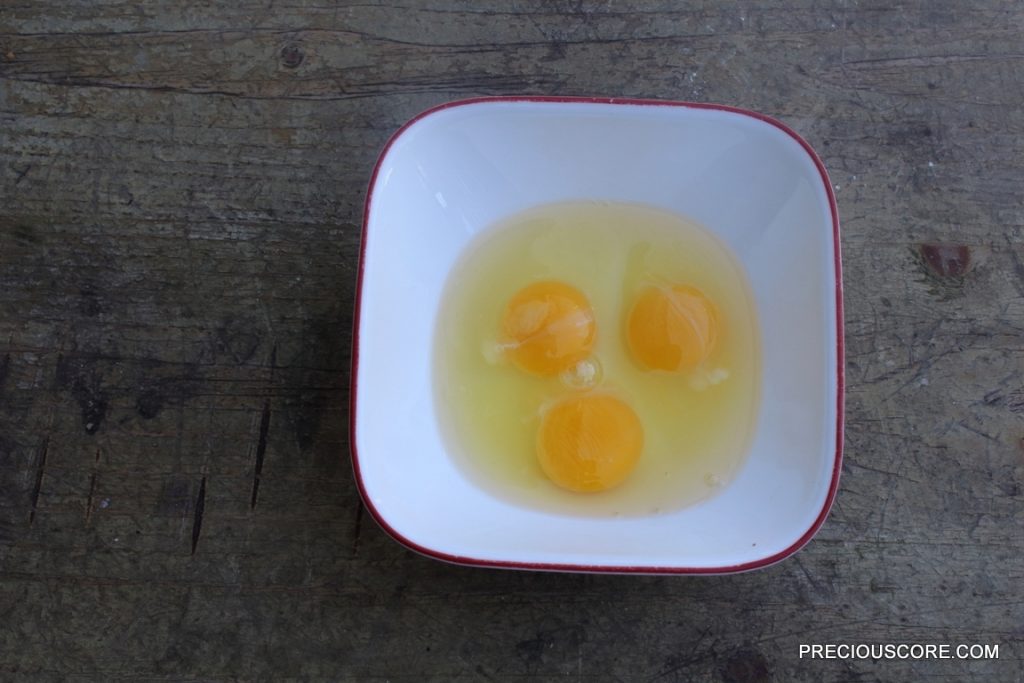 Three eggs in a bowl.