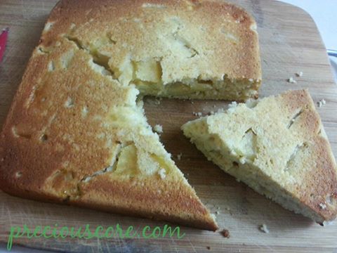 Apple cake with one slice being removed.