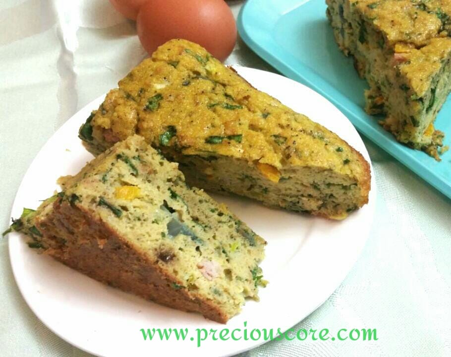 Two slices of egg cake on a plate.
