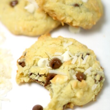 Coconut chocolate chip cookies on parchment paper.