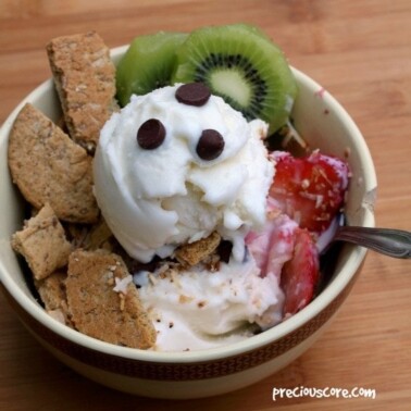 Spoon in a frozen yogurt breakfast bowl.