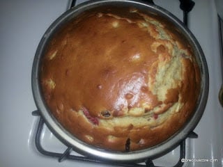 Fruit cake in a round pan.