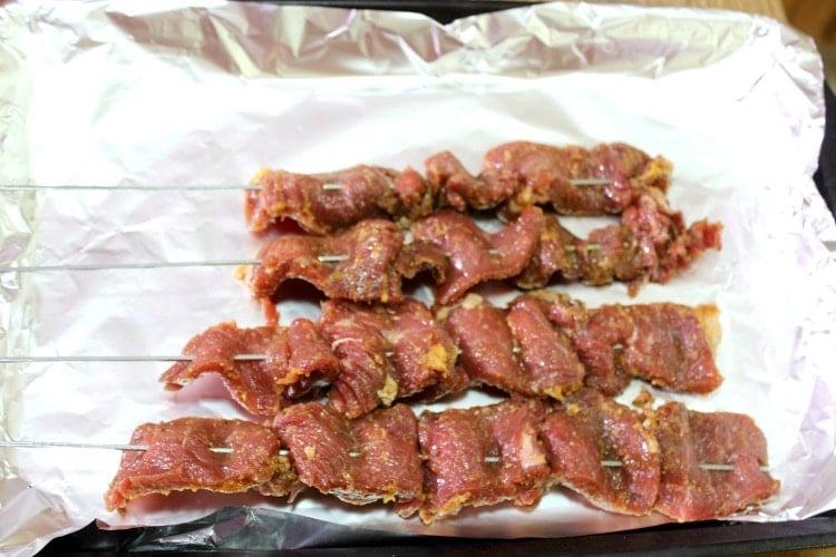 Raw Cameroonian soya on a lined baking sheet.