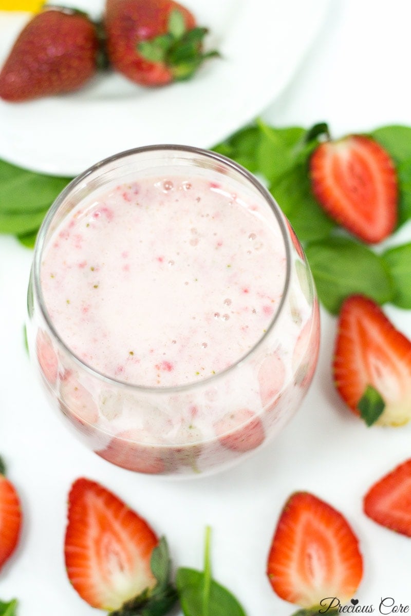 Strawberry banana smoothie in a small glass.