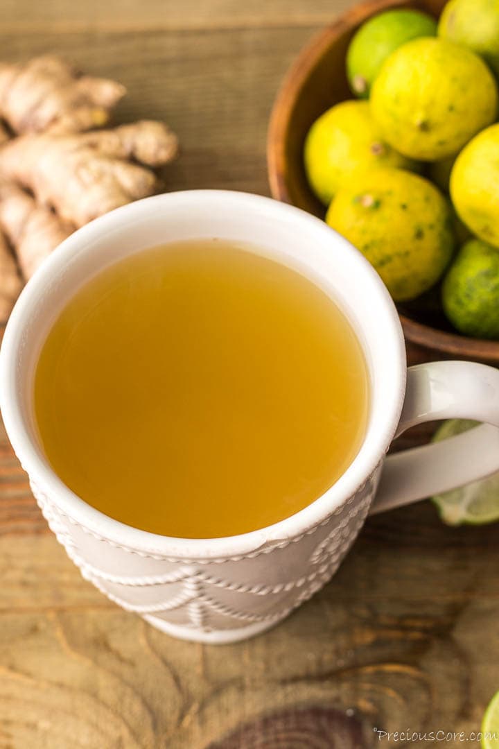 A white mug of ginger drink.