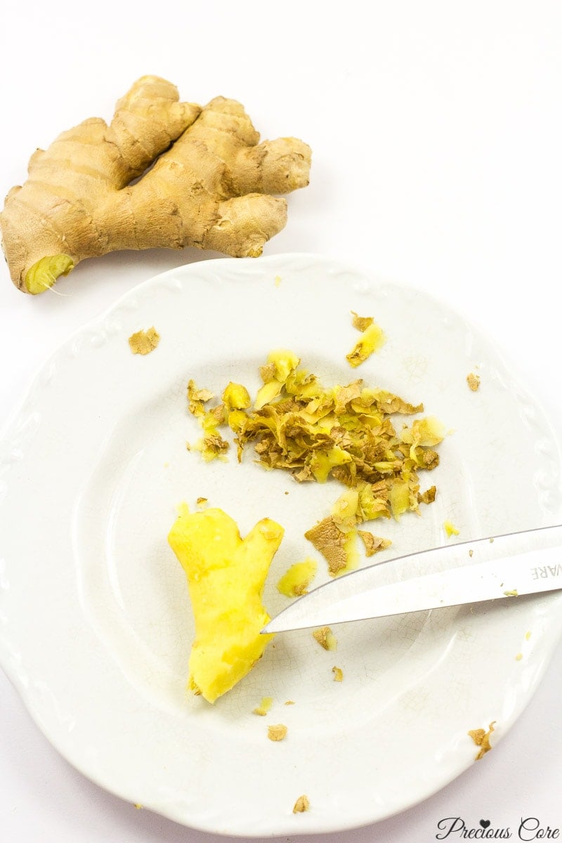 Peeled ginger on white plate.