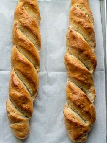 French bread loaves on large baking sheet