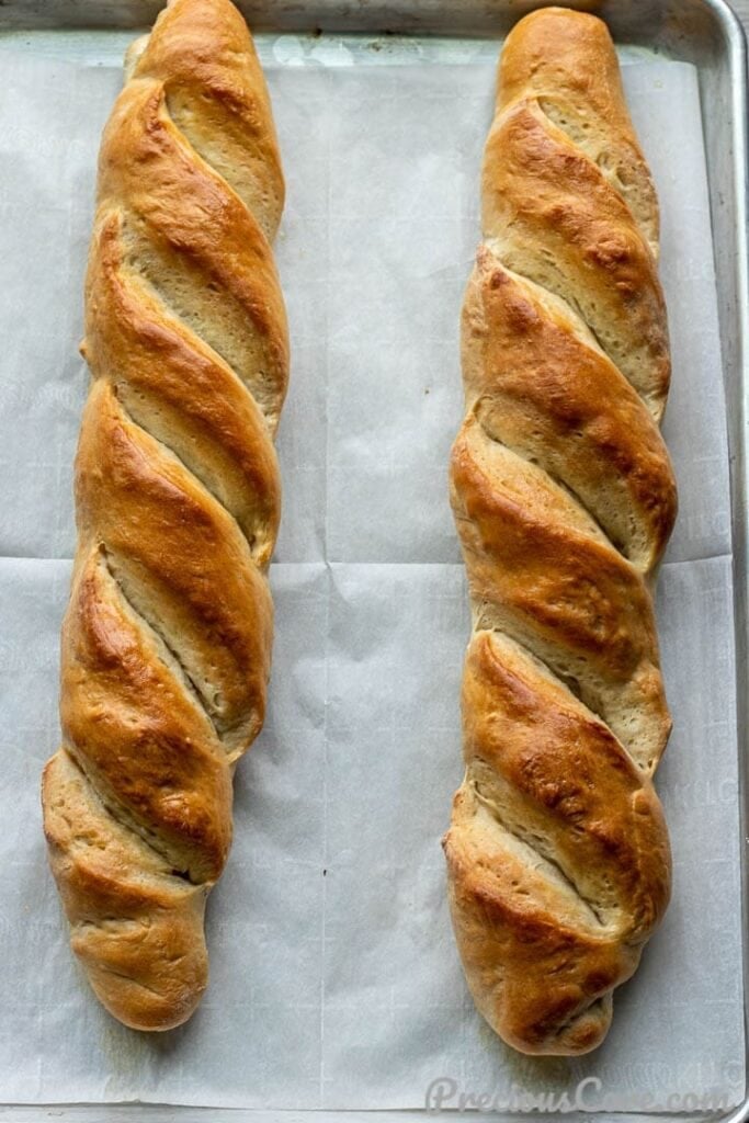 French bread loaves on large baking sheet