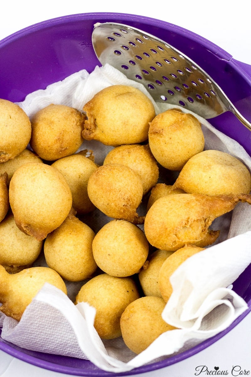 Cameroonian doughnuts on paper towels in a bowl.