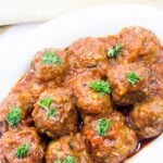 White dish of meatballs in tomato sauce - West African style.