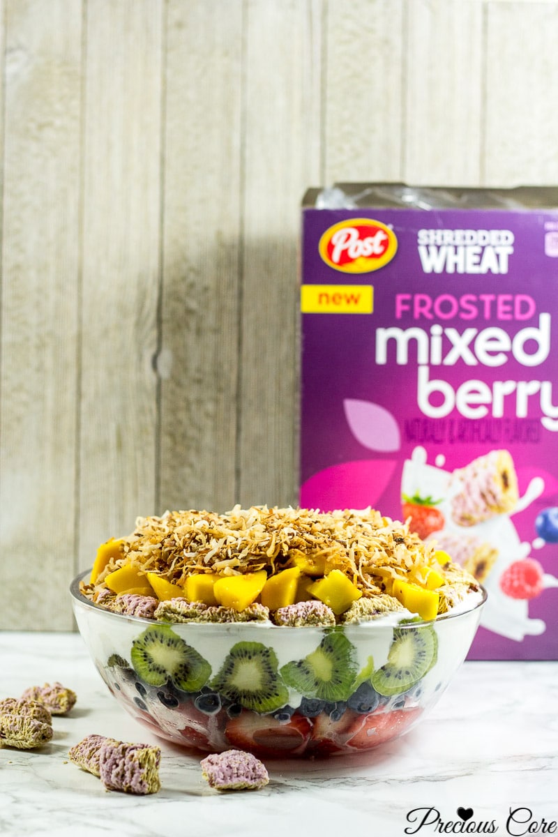 Seven layer fruit salad with a box of Frosted mixed berry Shredded Wheat.