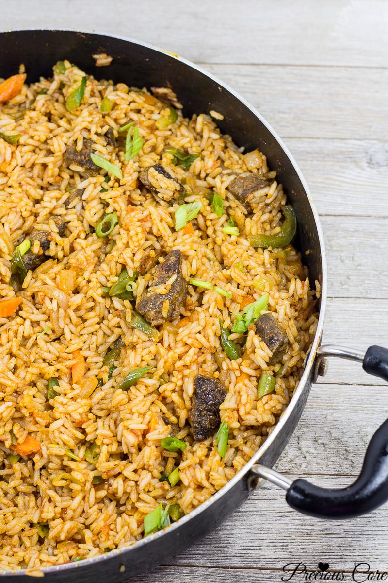 Cameroonian Jollof Rice in a wide pan.