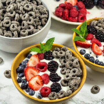 Two mixed berry parfait bowls.