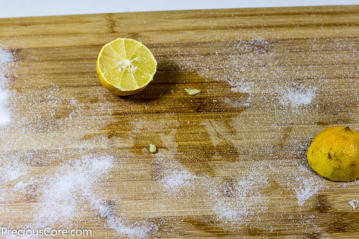 Clean chopping board with lemon - kitchen cleaning hacks