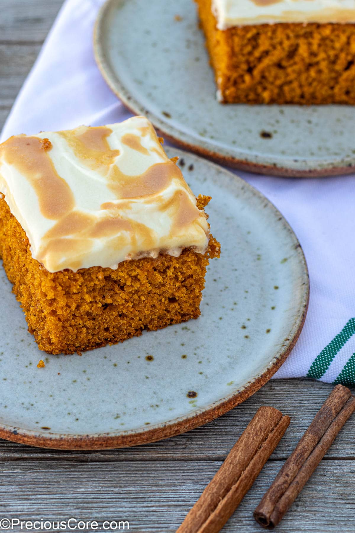 Slices of pumpkin cake on small plates.