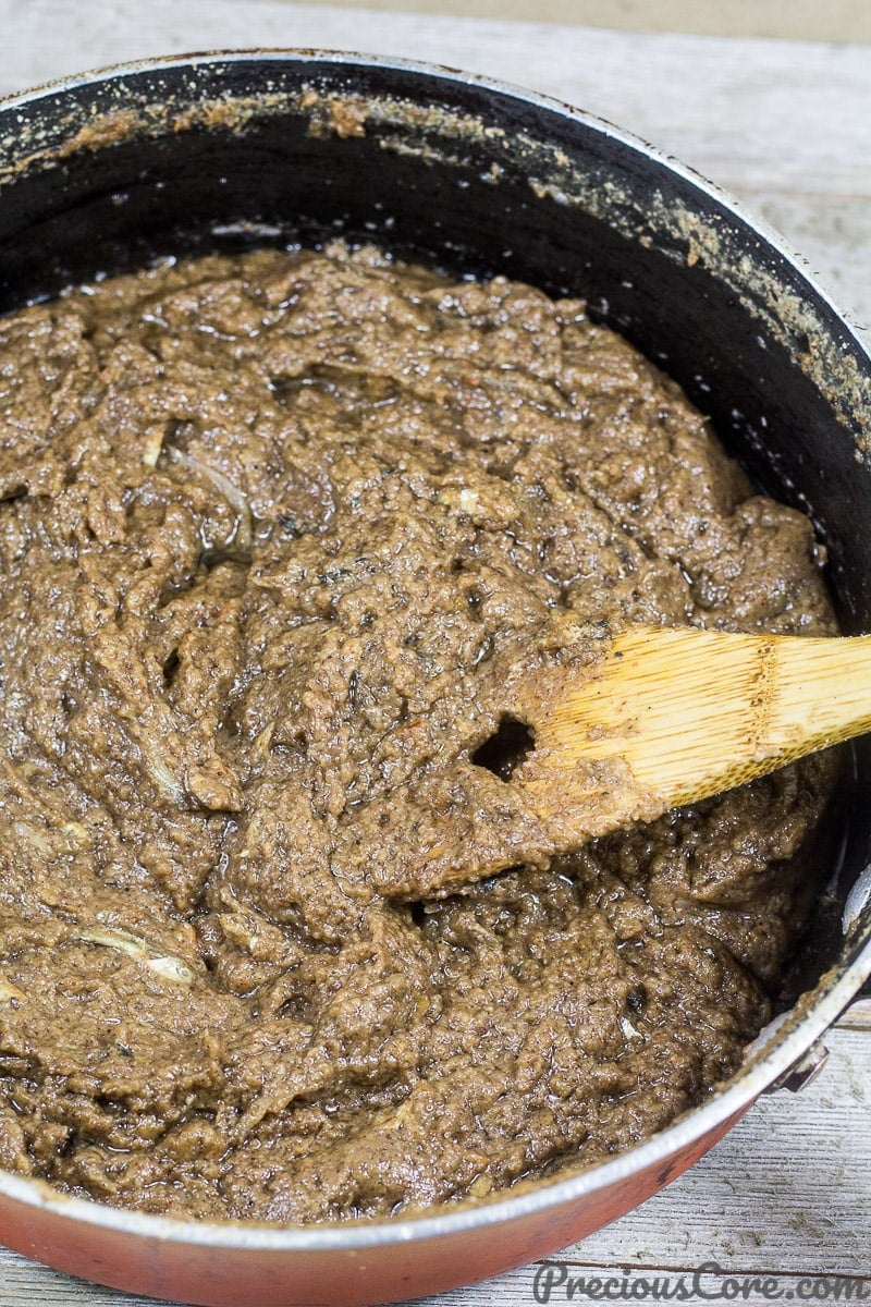 Wooden spatula stirring Cameroonian mboh.