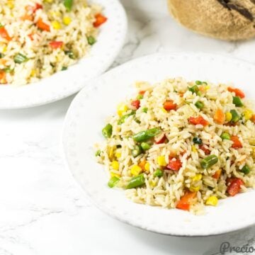 White bowls of coconut fried rice.