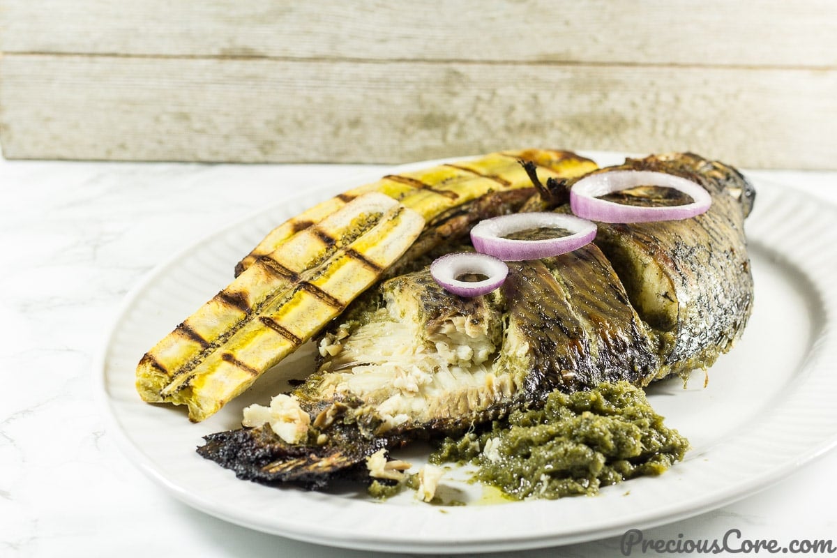 How African eat grilled tilapia fish 