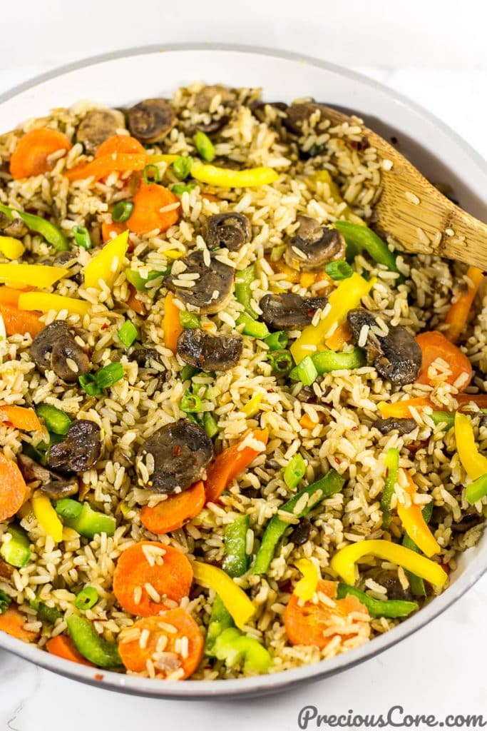 A pan of mushroom fried rice. Get mushroom fried rice recipe on Precious Core. #EasyDinner