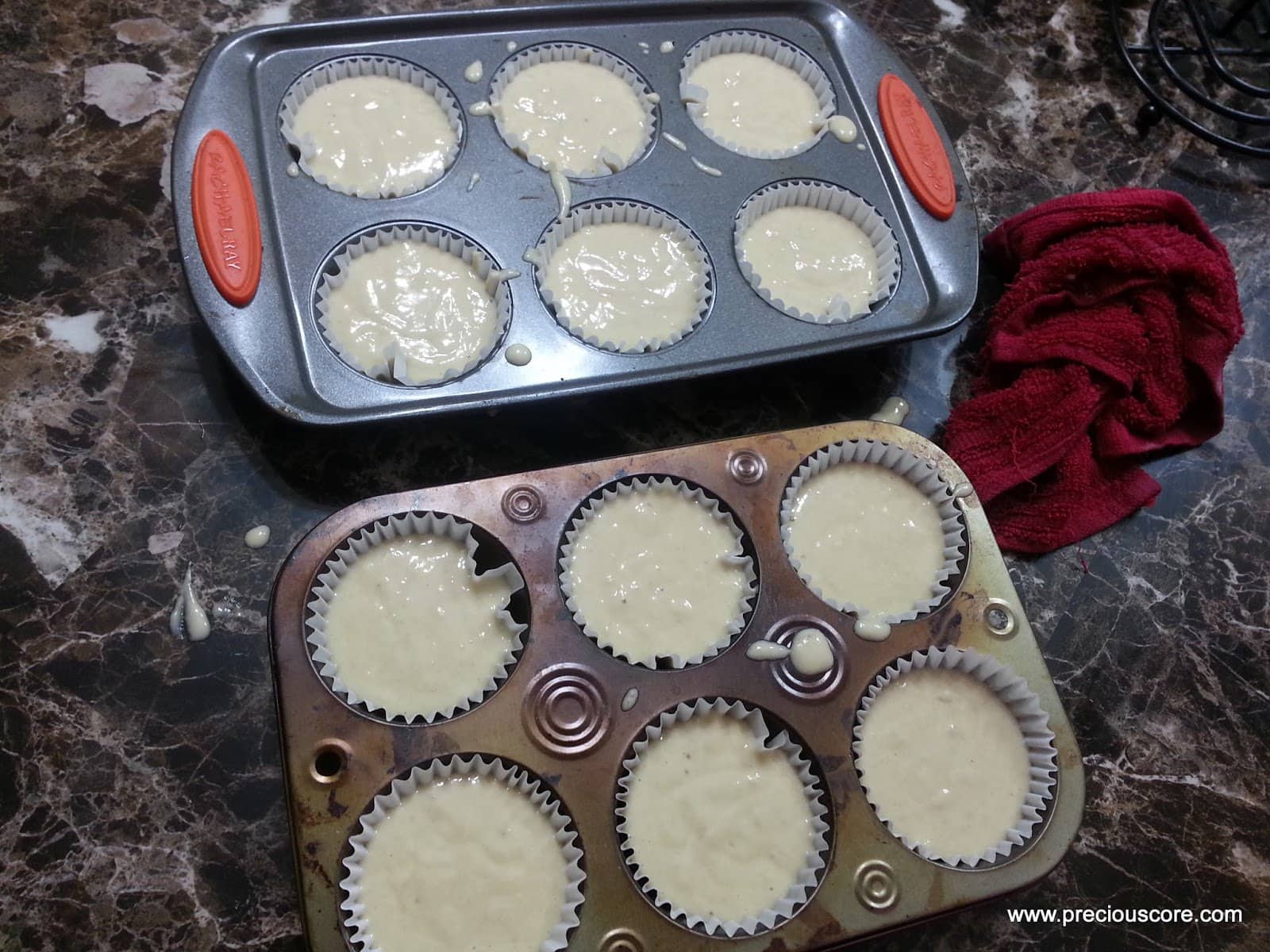 Muffin pans full of banana cake batter.