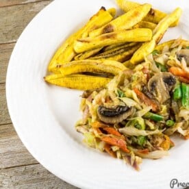 Cameroonian Cabbage Stew served with baked plantain fries.