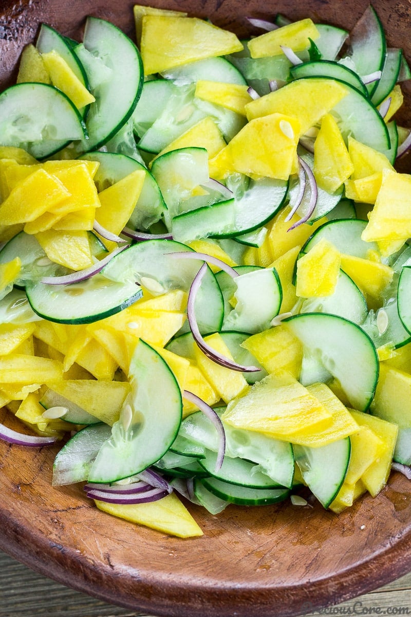Cucumber Mango Salad tossed in a bowl