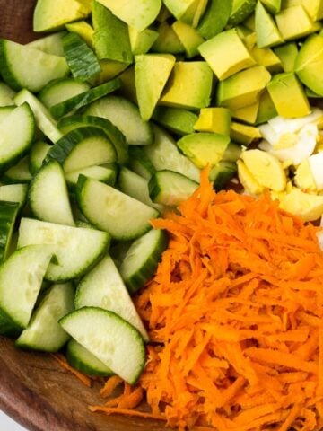 Breakfast Salad loaded with avocado, eggs and crunchy veggies.