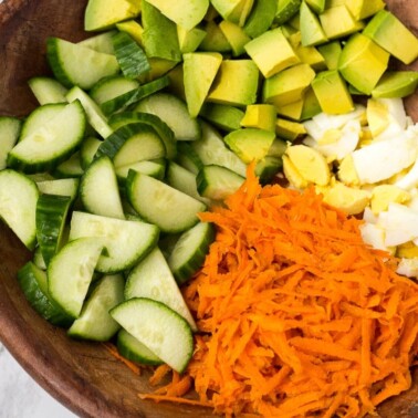 Breakfast Salad loaded with avocado, eggs and crunchy veggies.