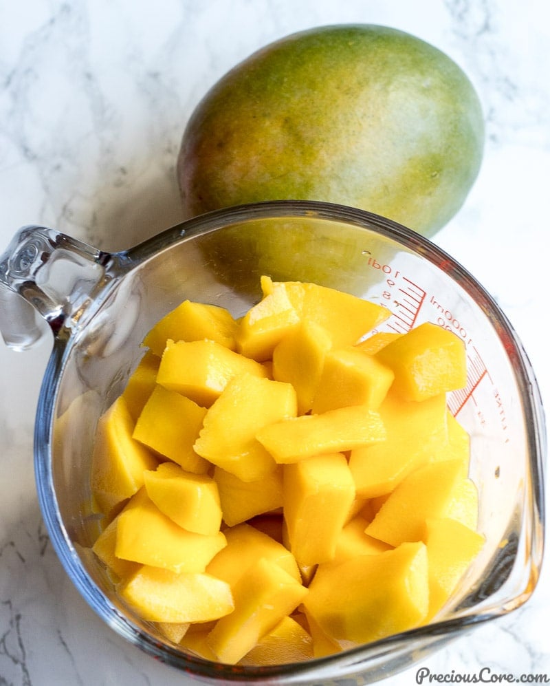 a cup of peeled mangoes for mango juice