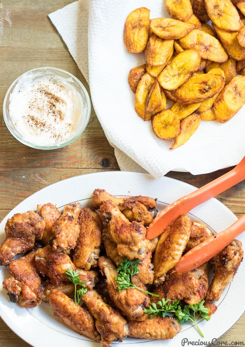 oven grilled chicken wings served with sweet fried plantains and herby mayo