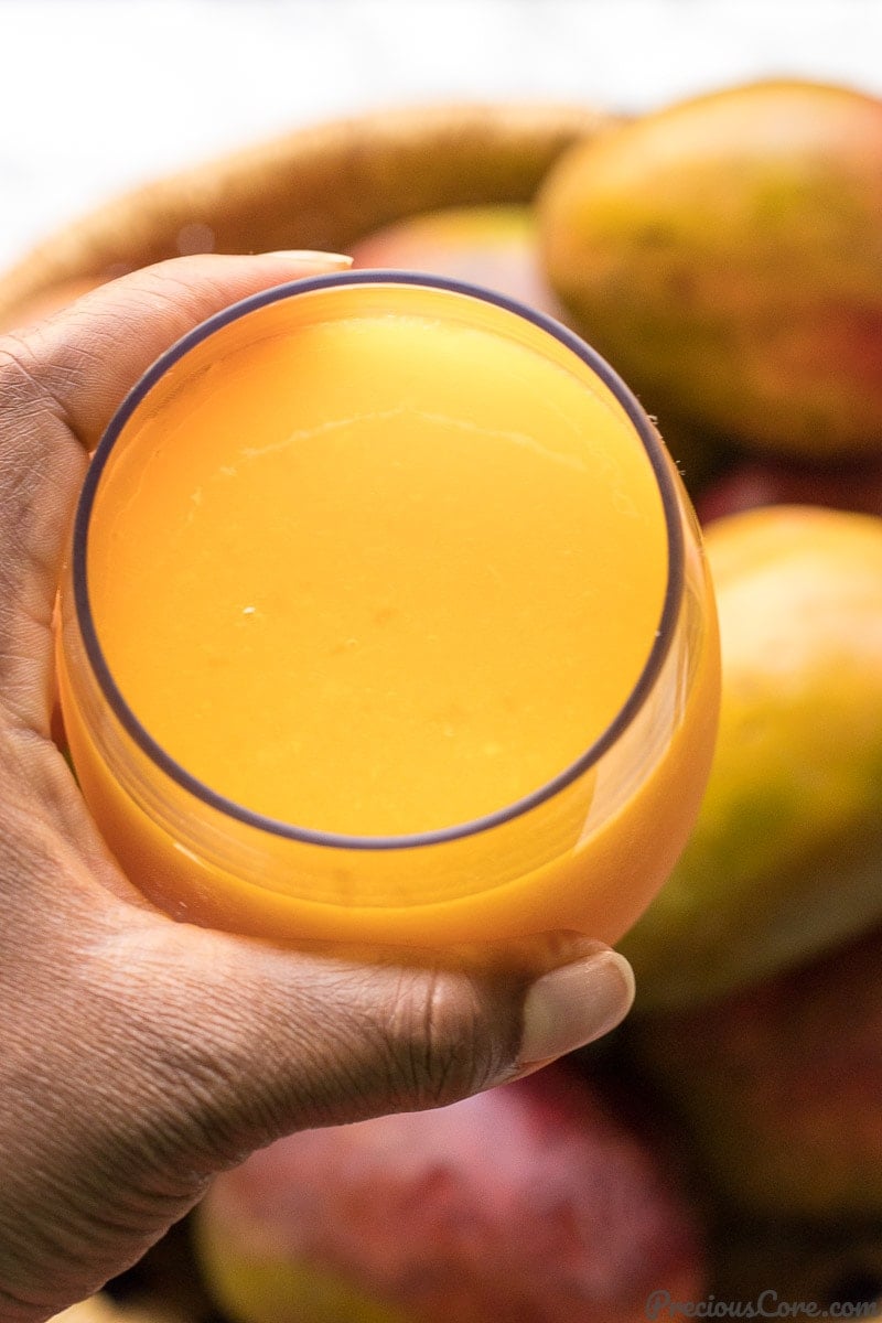 A cup of homemade mango juice
