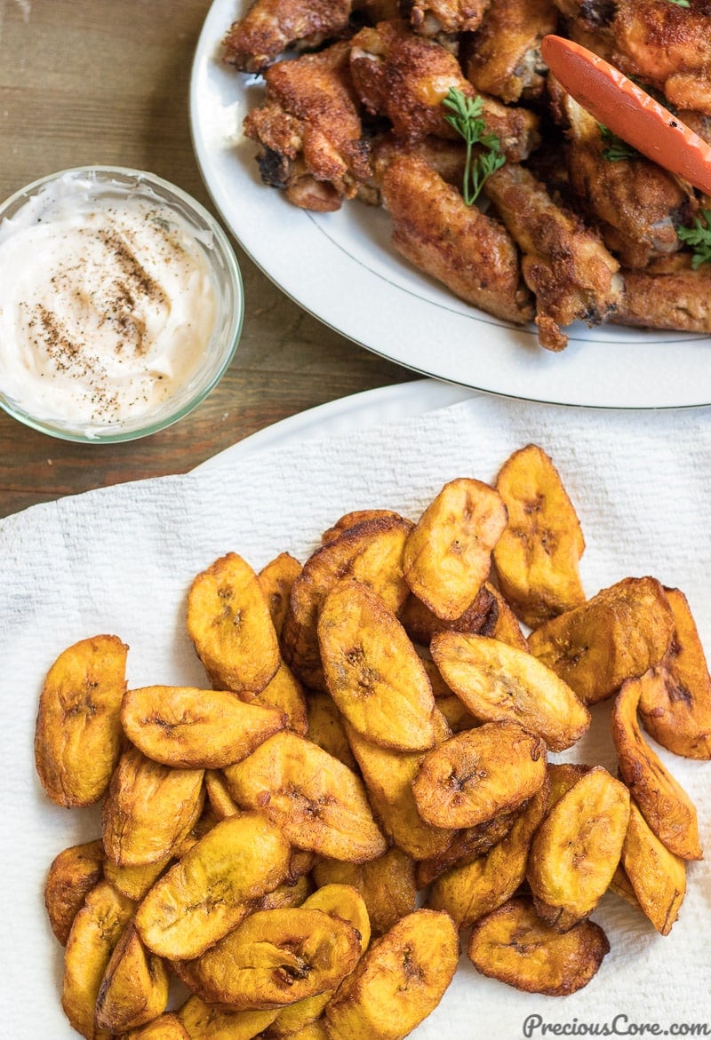 Fried plantains served with chicken wings.