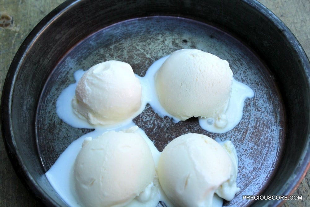 Four scoops of vanilla ice cream.