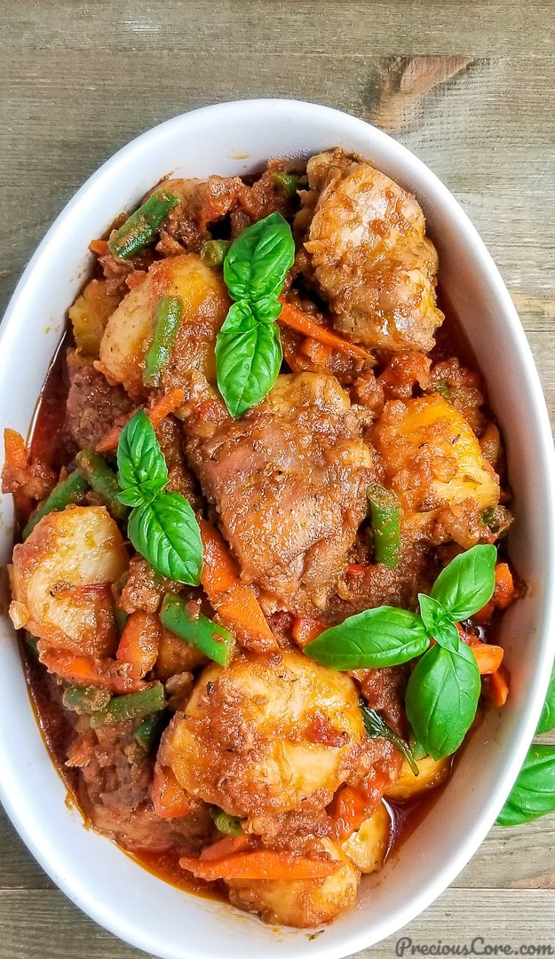 Potato hotpot in a bowl with basil.